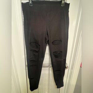 Black leggings with mesh cutouts
